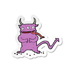 sticker of a cartoon little demon