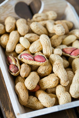 peanuts on wooden surface