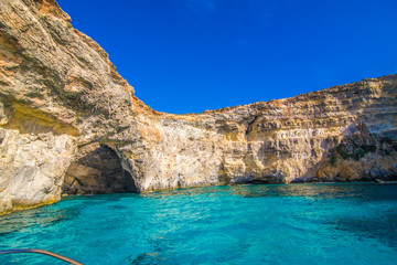 Fototapeta na wymiar Cliffs and sea view of Comino island from boat , Malta. Seascape at Malta, Comino and Gozo islands