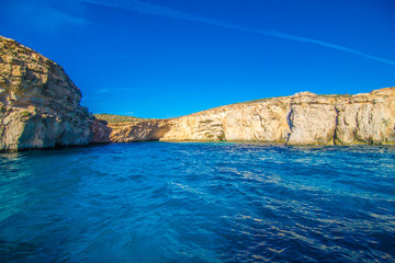 Fototapeta na wymiar Cliffs and sea view of Comino island from boat , Malta. Seascape at Malta, Comino and Gozo islands