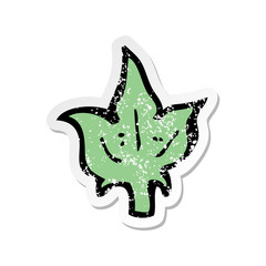 retro distressed sticker of a cartoon leaf symbol