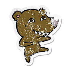 distressed sticker of a cartoon bear showing teeth while dancing