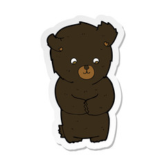 sticker of a cute cartoon black bear