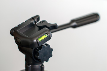 black tripod with green level