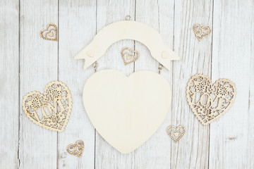 Wood heart sign on weathered whitewash textured wood