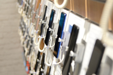 Smartphones on the counter of a electronics store