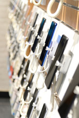 Smartphones on the counter of a electronics store