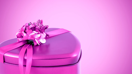 Pink heart shape gift box isolated on pink background