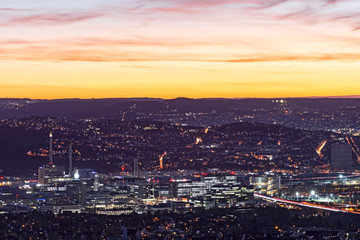 City lights of Stuttgart (Germany) after sunset from above. The industrialized valley of the river Neckar in the foreground.