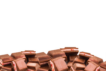 Delicious chocolates on white background