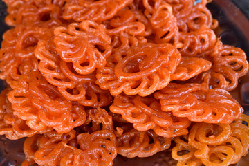 Luqmat al qadi, Zalabia, consisted of a yeast dough fried and then dipped in a syrup of honey and rose water