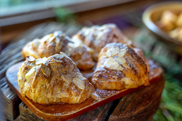 Homemade Fresh croissant with almonds on the plate