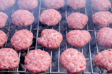 Grilling meatballs on the grill. Cooking  barbeque with charcoal in garden.