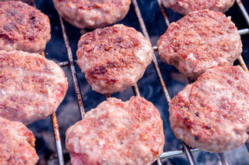 Grilling meatballs on the grill. Cooking  barbeque with charcoal in garden.