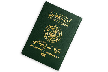 Green diplomatic biometric passport of the State of Qatar isolated on white background