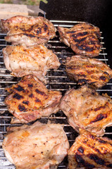 Chicken steak on the grill. Cooking chicken on the barbeque with charcoal in garden.