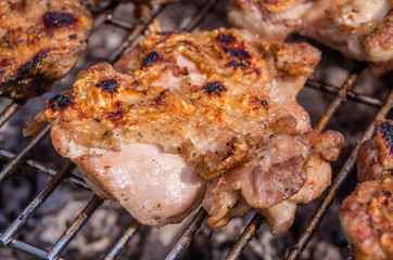 Chicken steak on the grill. Cooking chicken on the barbeque with charcoal in garden.