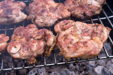 Chicken steak on the grill. Cooking chicken on the barbeque with charcoal in garden.