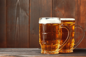 Glass beer on wood background