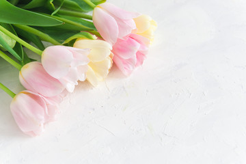 Bouquet of pink tulips on white background. Top view, copy space, close up. Spring card