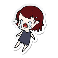 sticker of a cartoon crying vampire girl