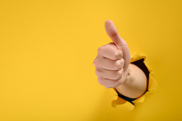 Hand showing a thumb up
