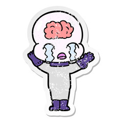 distressed sticker of a cartoon big brain alien crying