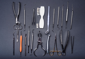 Composition of different dental equipment on gray background