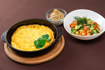 omelet in a pan and food
