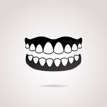 Dentures vector icon.