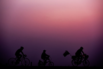 Obraz premium ride bicycle with sunset background.