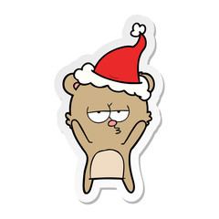 bored bear sticker cartoon of a wearing santa hat
