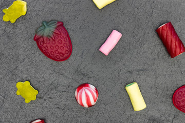 Candy sweets abstract minimal food dark background top view