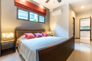 Luxury Interior design in bedroom of pool villa with cozy king bed. Bedroom with high raised ceiling  home, house ,building