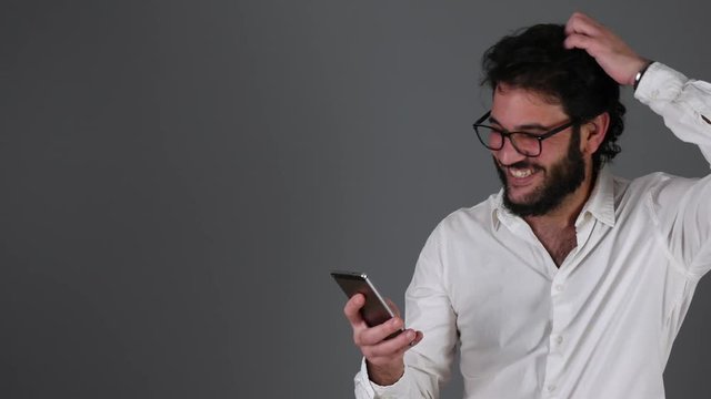 Man talking on the phone and pulling his hair