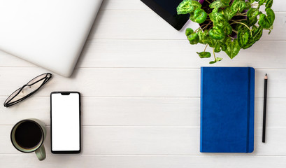 Top view of working place composition on white table