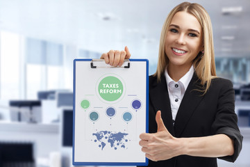 Business, technology, internet and networking concept. Young entrepreneur showing keyword: taxes...