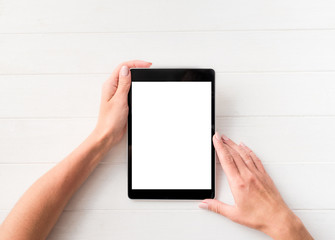 Top view of girl using tablet on white table background