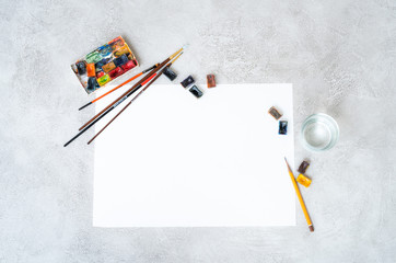 Composition of drawing equipment on gray background