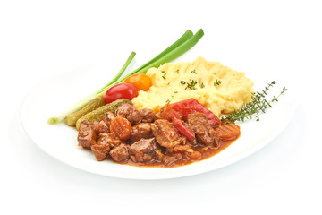 Beef stew, traditional homemade European meat goulash, Hungarian bograch, close-up, isolated on white background