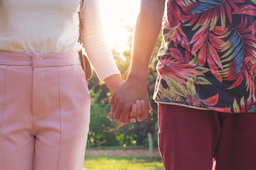 Couples holding hands.Summer in love.