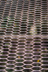 Old lattice, mesh. Decorative mesh, grunge texture. Stock photo