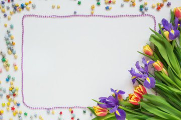 Festive frame of a bouquet of flowers and stars