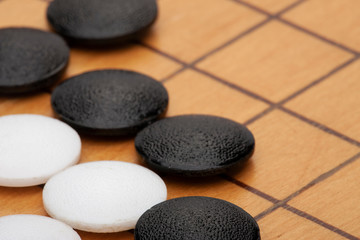 Fototapeta na wymiar Go board,traditional Chinese strategy board game.Game brain training