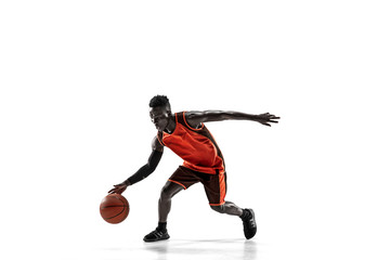 Full length portrait of a basketball player with a ball isolated on white studio background. advertising concept. Fit african anerican athlete with ball. Motion, activity, movement concepts.