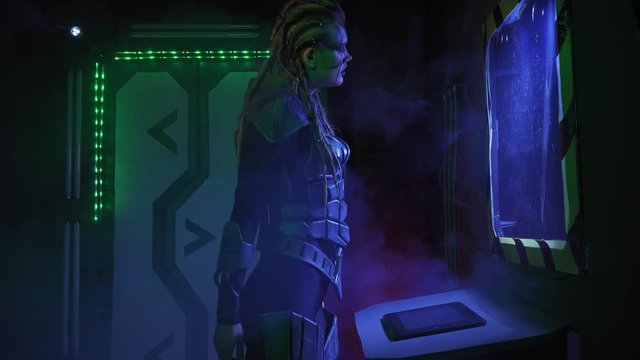 Alien spaceship with many pieces of technology, female alien is using a device, 4k