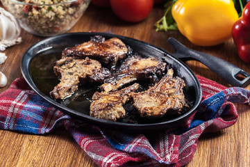 Roasted lamb chops on a roasting dish