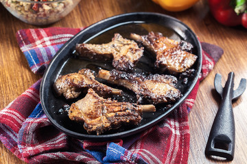 Roasted lamb chops on a roasting dish
