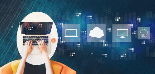 Cloud computing with person using a laptop on a white table