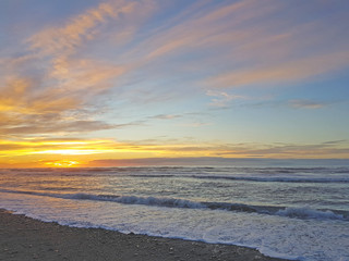 Sonnenuntergang am Strand in Neuseeland